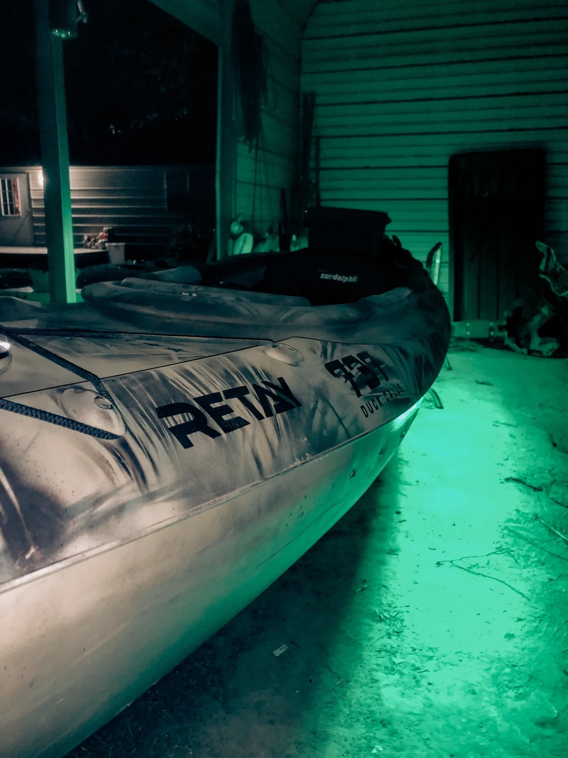 Duck boat illuminated with green lighting